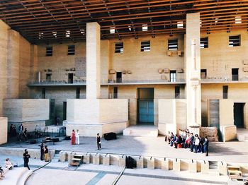 People walking in historic building