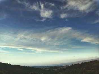 Scenic view of landscape against cloudy sky