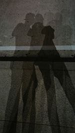 Shadow of people on wall