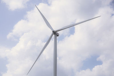 Low angle view of windmill against sky