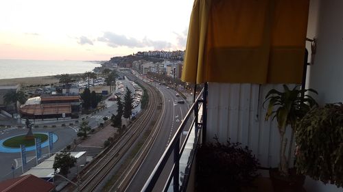 Panoramic view of city by sea against sky