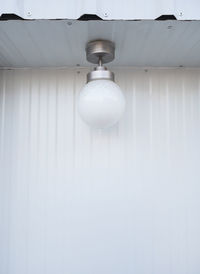 Low angle view of illuminated light bulb