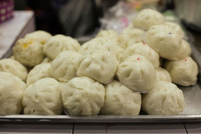 Tray of uncooked dumplings.