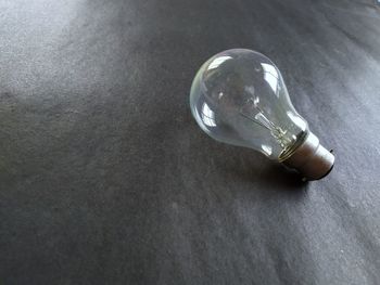 High angle view of light bulb on table
