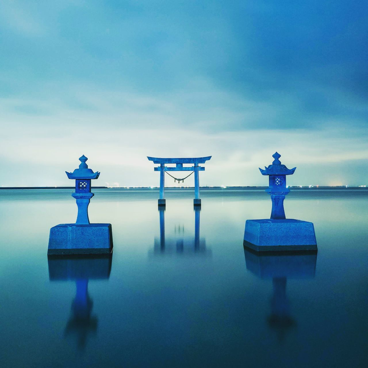 cloud - sky, sky, blue, sea, water, tranquil scene, beauty in nature, tranquility, scenics, nature, day, horizon over water, outdoors, statue, no people, coin-operated binoculars