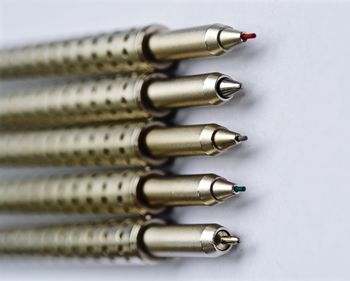 Close-up side view of pens