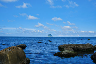 Overlooking the keelung islet standing in the blue waters, mysterious volcanic island.