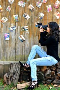 Side view of woman using mobile phone