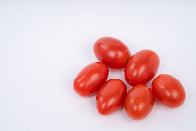 High angle view of tomatoes over white background