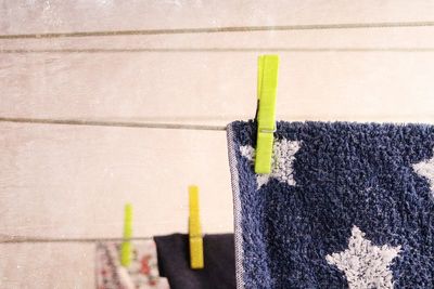 Close-up of blue towel drying on clothesline