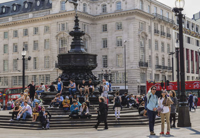 People at shaftesbury memorial fountain on piccadilly circus