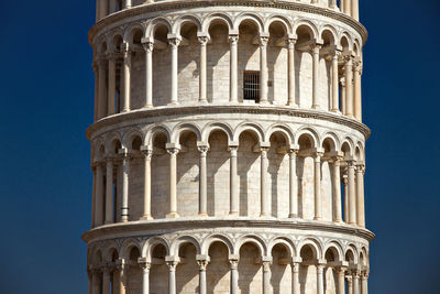 Low angle view of historical building against clear blue sky