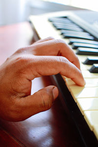 Cropped hands of woman using mobile phone