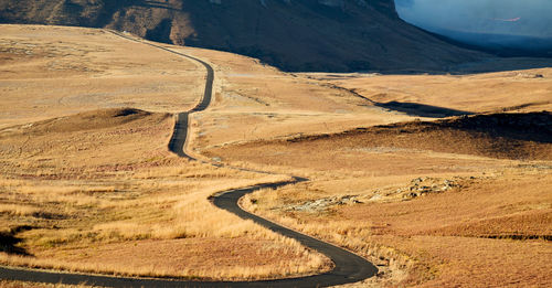 High angle view of road leading towards mountain