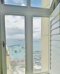 View of sea seen through window