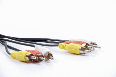 Close-up of colorful computer cables over white background