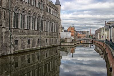 Arch bridge over canal in city