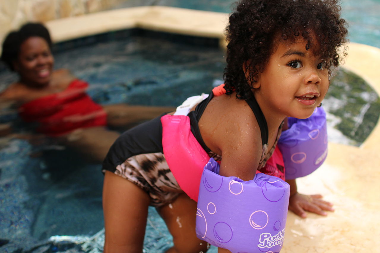 HAPPY GIRL WITH SWIMMING POOL