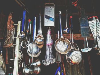 Kitchen utensils hanging for sale at market