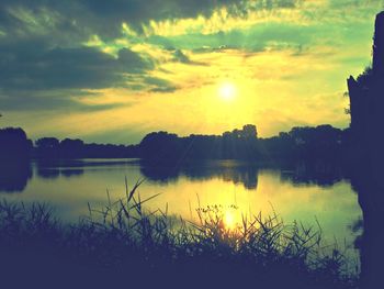 Scenic view of silhouette trees against sky during sunset