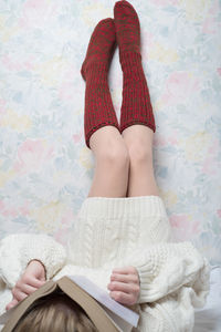 Low section of woman relaxing on floor