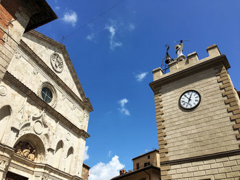 Low angle view of clock tower against =sky