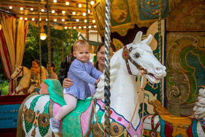 Full length of girl standing in amusement park