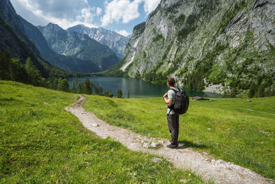 Full length of man standing on mountain road