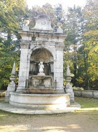 Statue in front of historical building