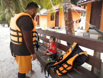 Man with baby girl at beach