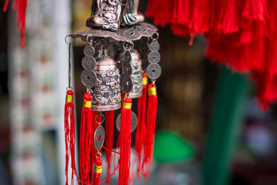 Close-up of wind chime hanging at market stall