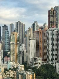 Modern buildings in city against sky