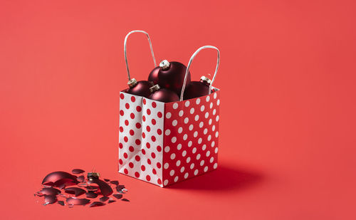 Close-up of heart shape against red background