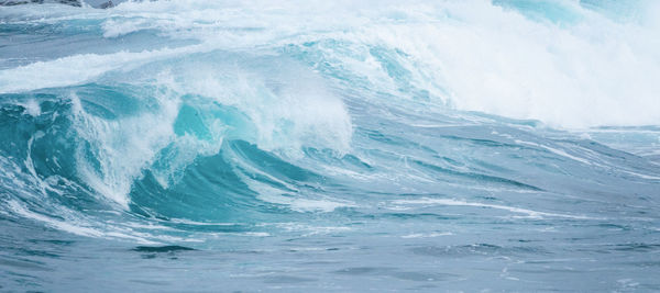 Full frame shot of waves splashing in sea