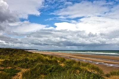 Scenic view of beach against sky