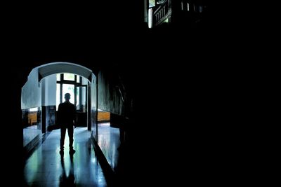 Man walking in corridor