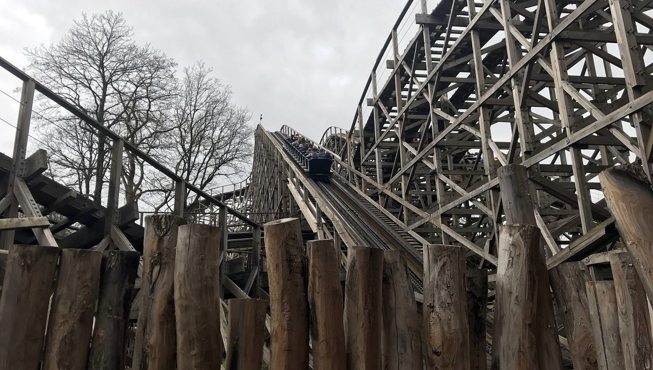 LOW ANGLE VIEW OF OLD METAL STRUCTURE AGAINST SKY