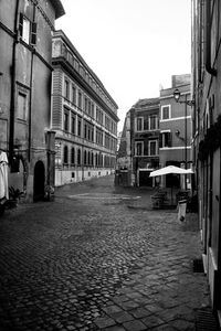 Street amidst buildings against sky