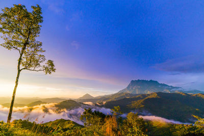 Scenic view of mountains against sky during sunset