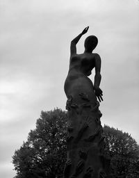 Low angle view of statue against sky