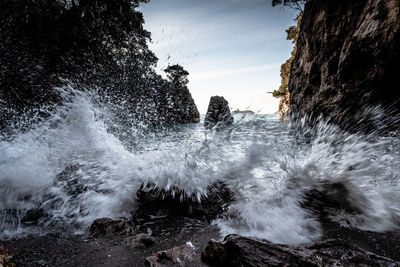 Sea waves splashing on rocks