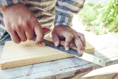 Man working on wooden table
