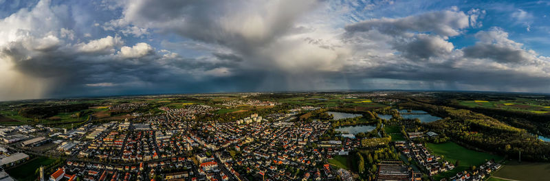 High angle view of city against cloudy sky