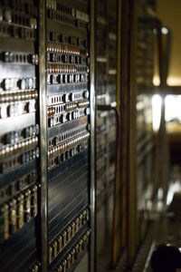 Close-up of bottles in shelf