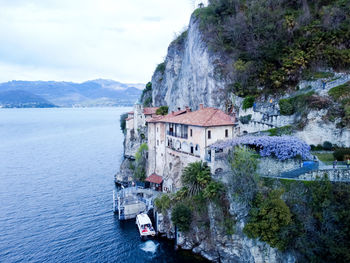 Drone view at the monastery of santa caterina del sasso on lake maggiore italy