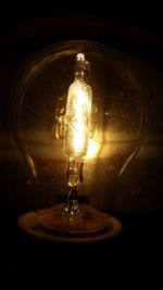 Low angle view of lit light bulb