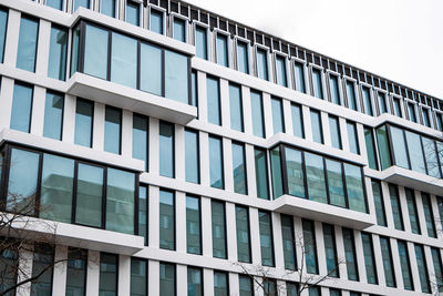 Low angle view of modern building against sky