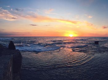 View of calm sea at sunset