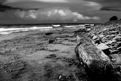 Scenic view of sea against cloudy sky