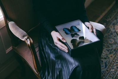 High angle view of woman holding book